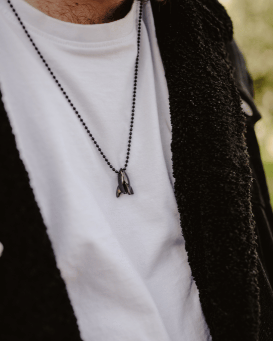 Model wearing Rocket Ship Pendant